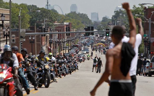 Michael Brown's funeral procession goes to the cemetery